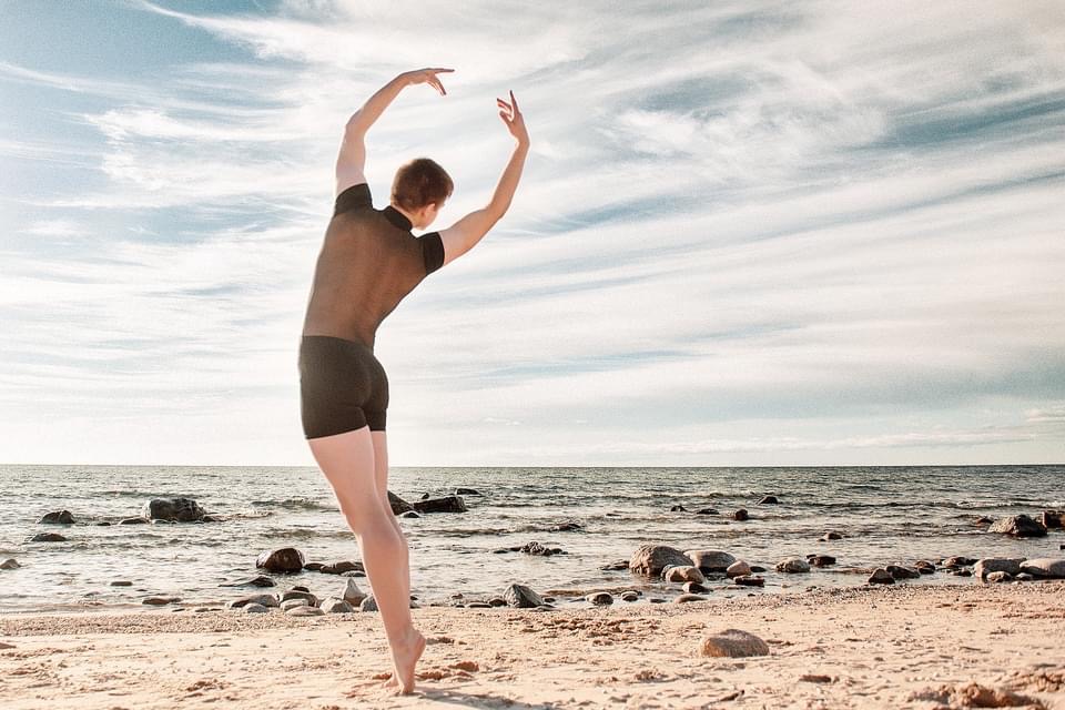 Greyson Janka dancing on beach